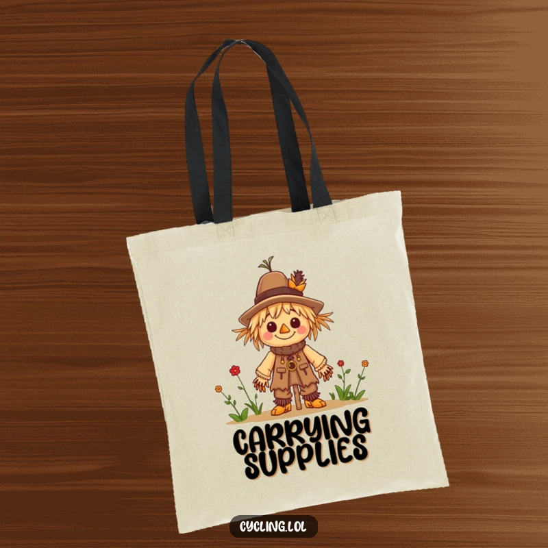 Funny tote bag featuring a character cheerfully building a tiny scarecrow, ideal for carrying craft supplies.